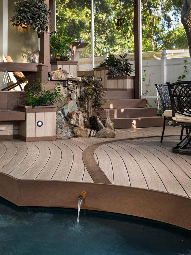 Workers performing balcony repair work on concrete floor